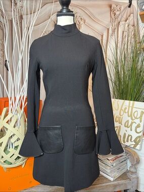 Black Long-Sleeve Mini Dress with Flared Cuffs and Front Patch Pockets